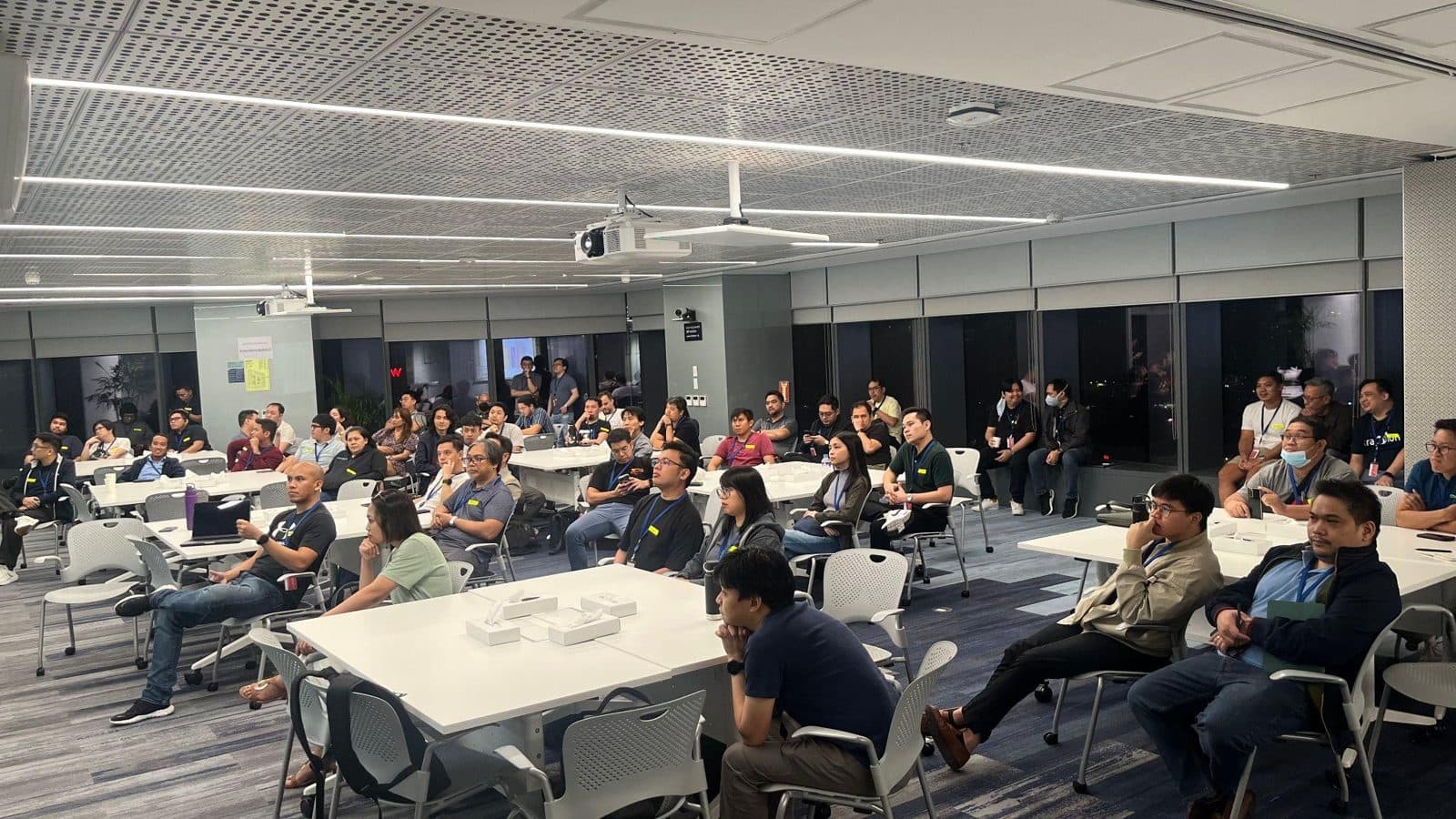 Engineering leaders listening to a talk at an eHeads meetup